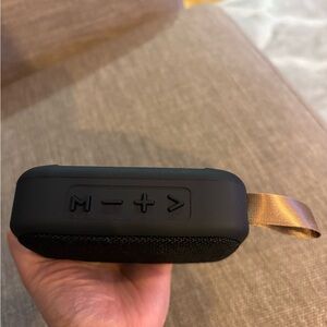 Black and Tan Portable Bluetooth Speaker with Minimalist Design